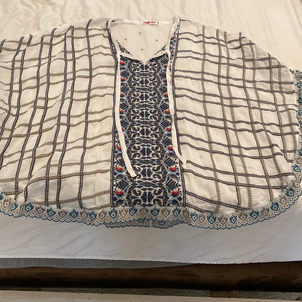 Gorgeous Johnny was pancho style blouse. Size small
